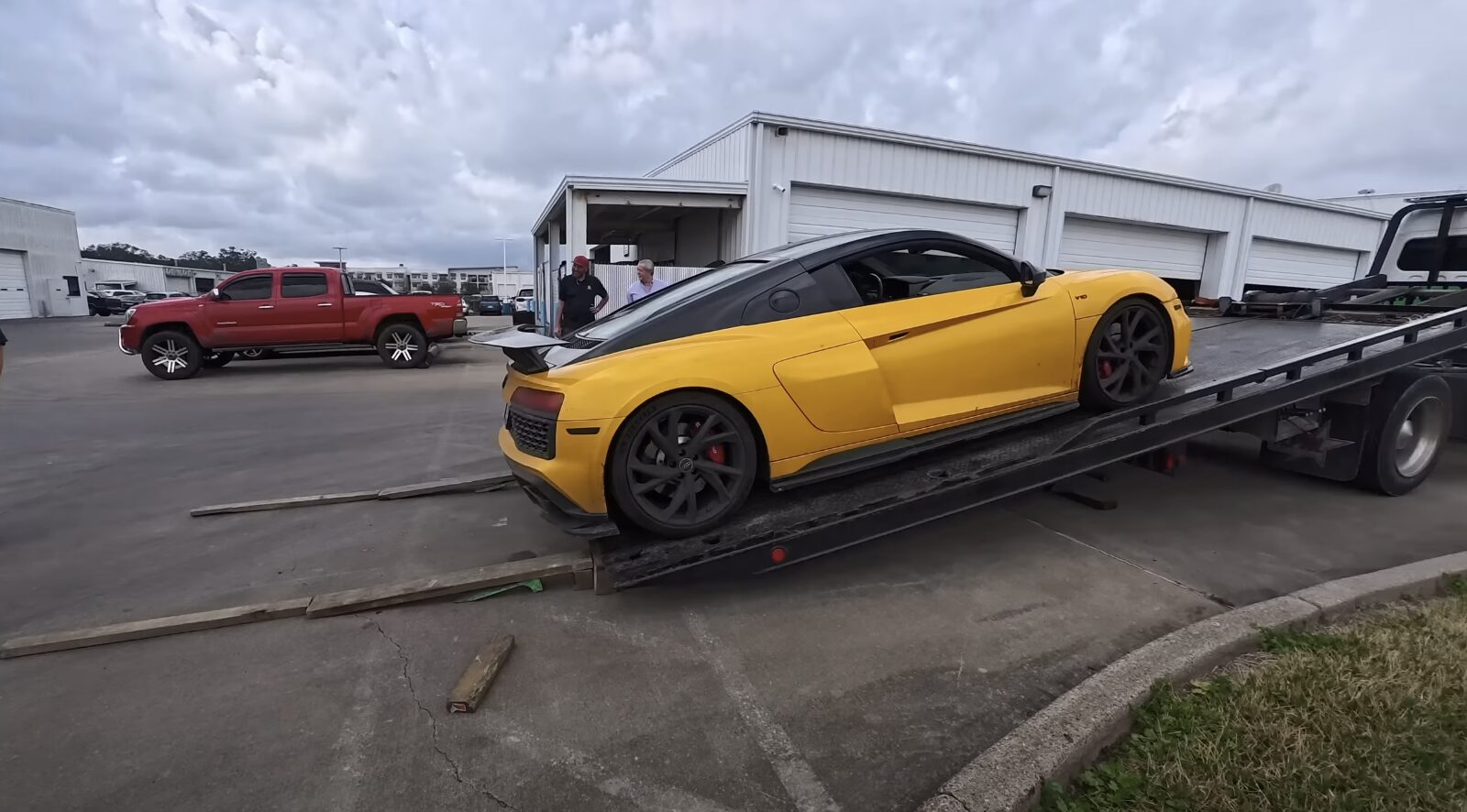 Professional towing service loading luxury vehicle for safe transport